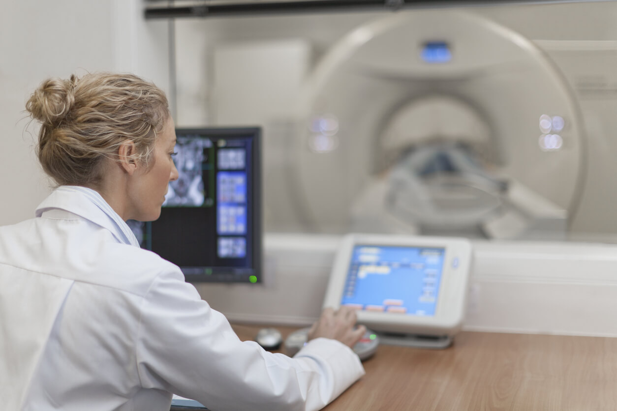 CT scan expert looking at monitor