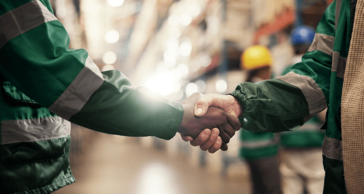 Handshake between two men at warehouse
