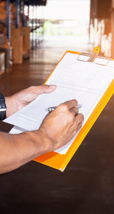 Warehouse worker holding clipboard